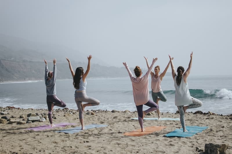 Group of women practicing meditation together in a circle